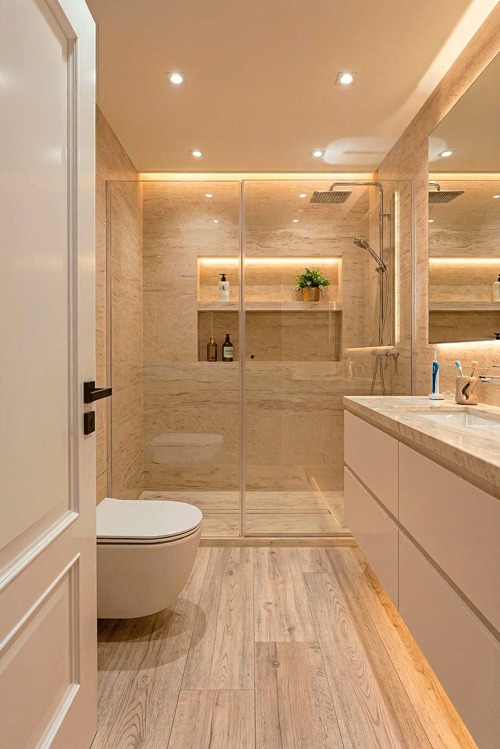 Casa Iván: baño con ducha acristalada, hornacina iluminada y mueble de lavabo suspendido